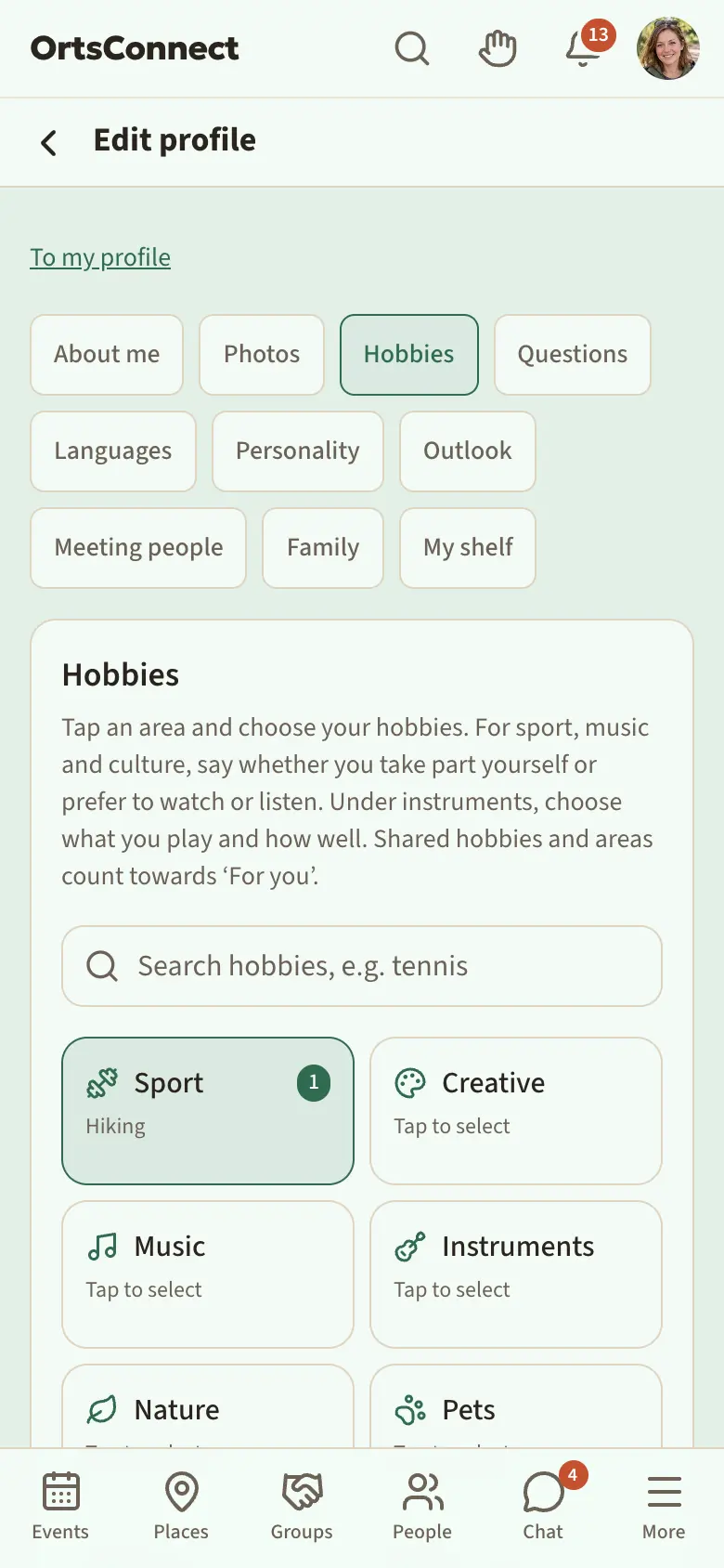 My profile › Edit profile on a phone: the tab bar at the top with About me, Photos, Hobbies, Questions …; ‘Hobbies’ is active and has a coloured dot; at the bottom the ‘Show on my profile’ tick box and below it, above the bar, the sticky ‘Not saved’ bar with the ‘Save Hobbies’ button highlighted