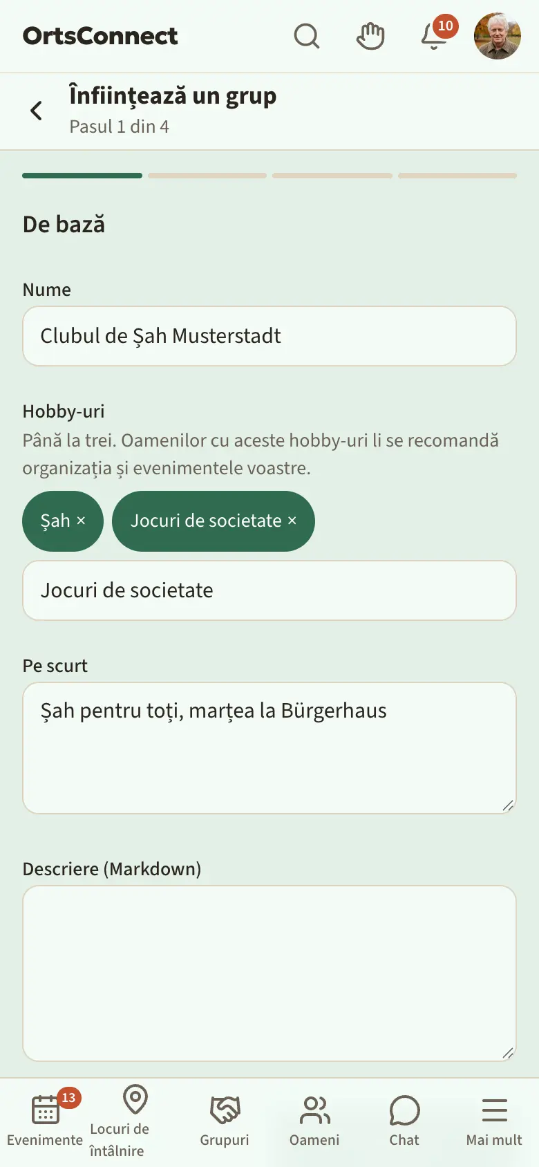 Asistentul „Înființează un grup”, pasul 1 „De bază” cu numele completat și două hobby-uri alese la „Hobby-uri”, câmpul „Caută un hobby …” dedesubt